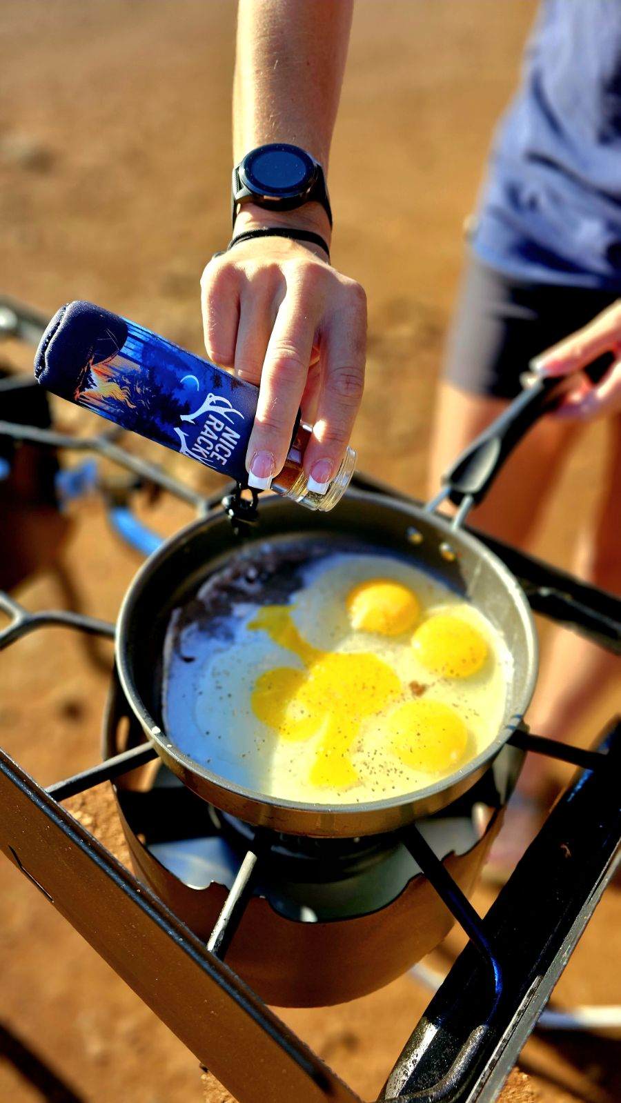 NICE RACK filled with Organic Spices Neoprene Carry Case + Spice Labels egg breakfast cooking on the tailgate of the truck using a compact organic camp spice shaker gift